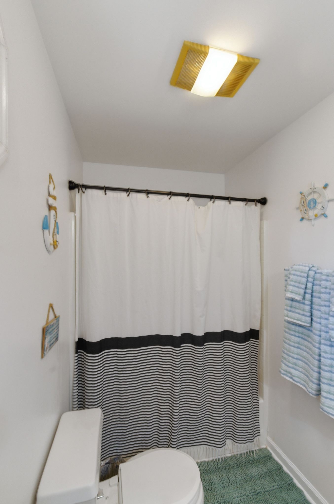 99 Smoke Rise Circle Manchester, TN 37355 - Photo 33 of 45 a bathroom with a toilet and a shower curtain