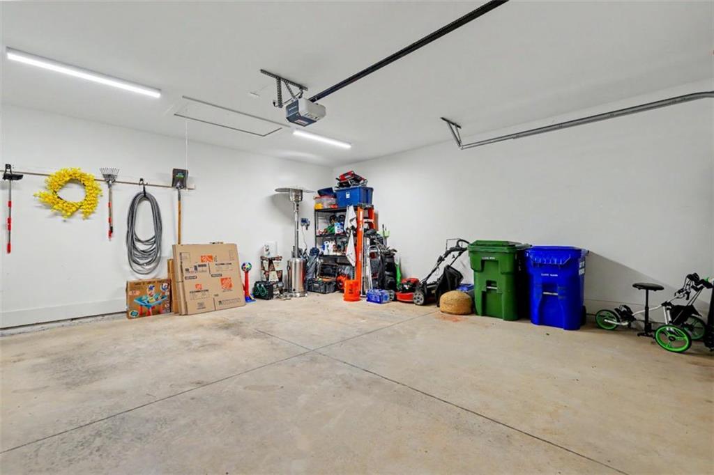 943 Clubside Drive Monroe, GA 30655 - Photo 62 of 93 a view of a garage with a bike and white walls
