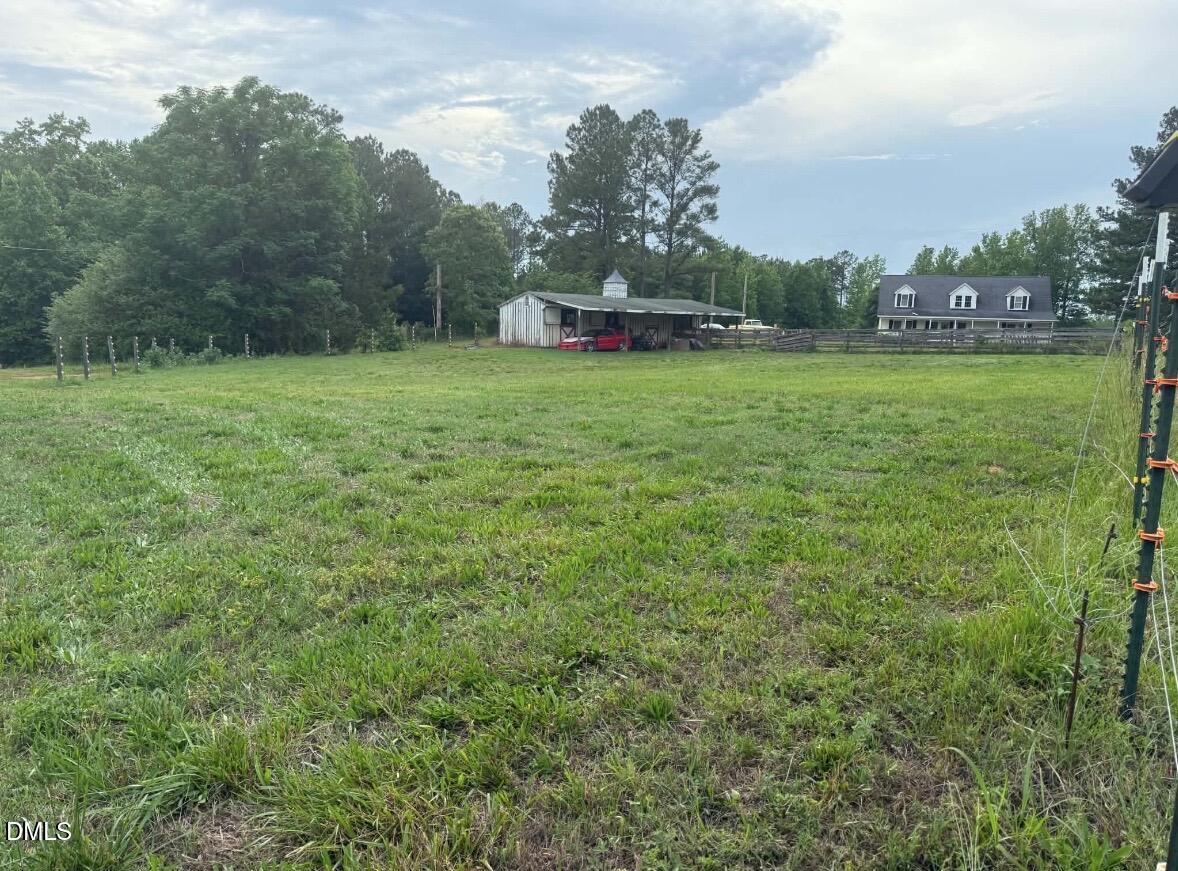 344 J B Leonard Road Castalia, NC 27816 - Photo 28 of 32 a view of a field of grass and trees