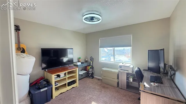 a bathroom with a toilet a sink and a large mirror