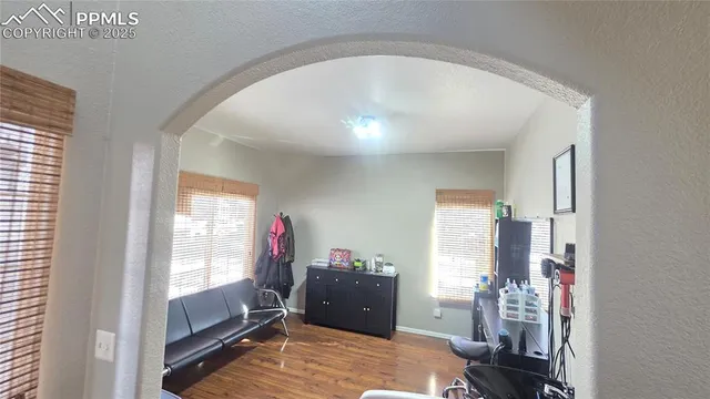 a living room with furniture and a window