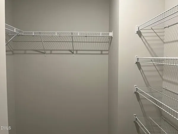 a view of a room with racks on the wall