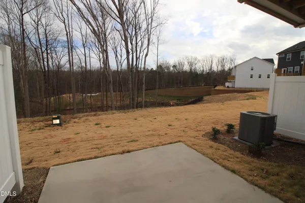 a view of a backyard of the house