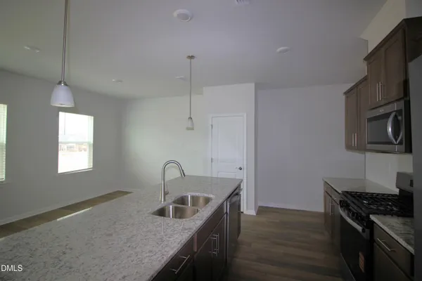 a kitchen that has a sink and a stove