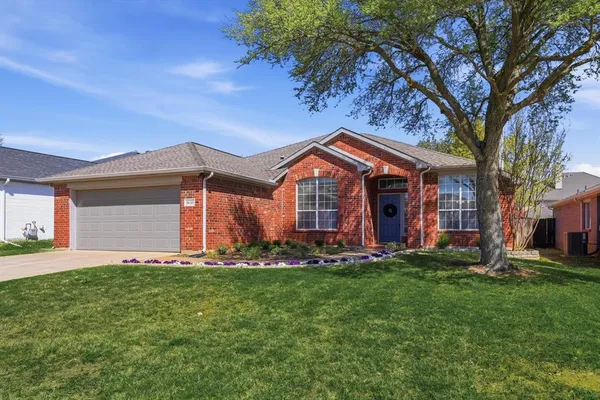 a view of kitchen with microwave and cabinets