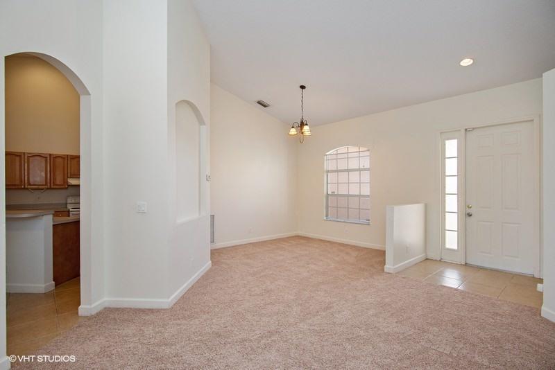 549 Southwest Aster Road Port St. Lucie, FL 34953 - Photo 5 of 12 03_549SWAsterRoad_93001_LivingRoomDining