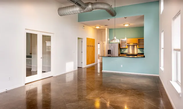 a bathroom with a sink mirror and a shower