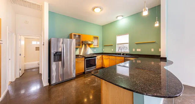 a kitchen that has a sink and a stove