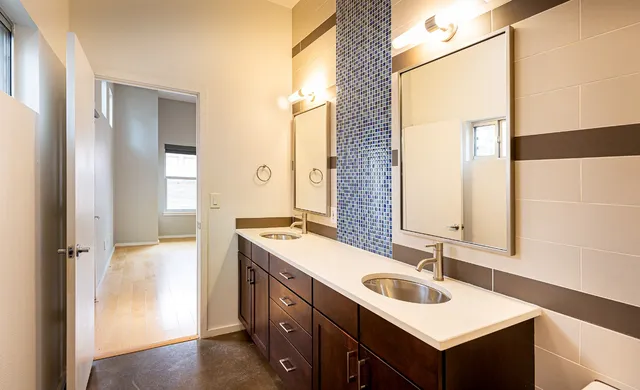 a bathroom with a shower and a glass door