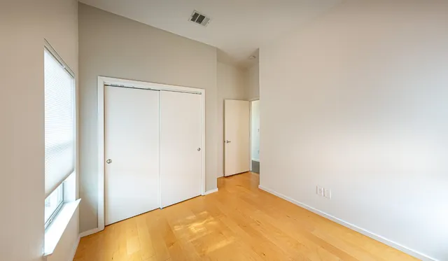 a view of a chair and table in the balcony
