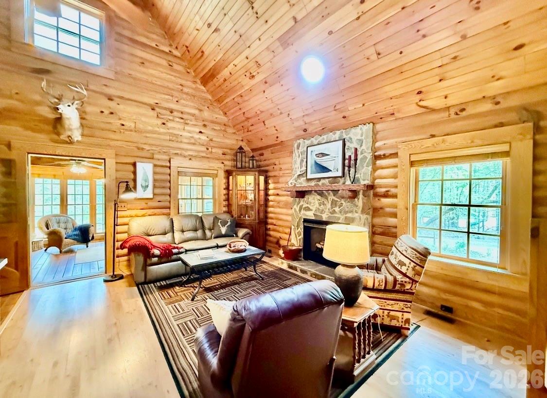 57 Club Lane Winnsboro, SC 29180 - Photo 14 of 48 a living room with furniture a fireplace and wooden floor