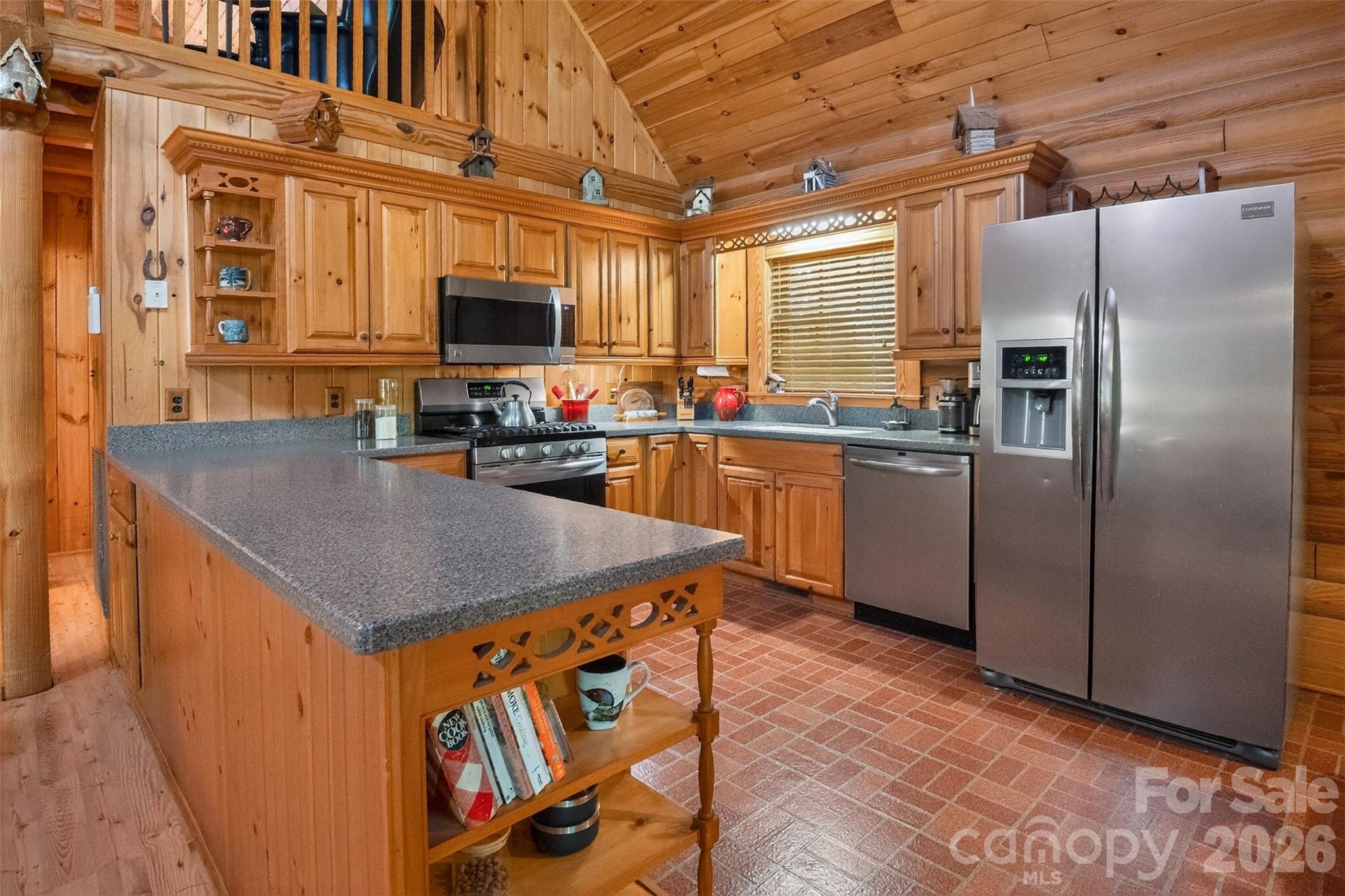 57 Club Lane Winnsboro, SC 29180 - Photo 16 of 48 a kitchen with stainless steel appliances granite countertop a sink a stove and a refrigerator