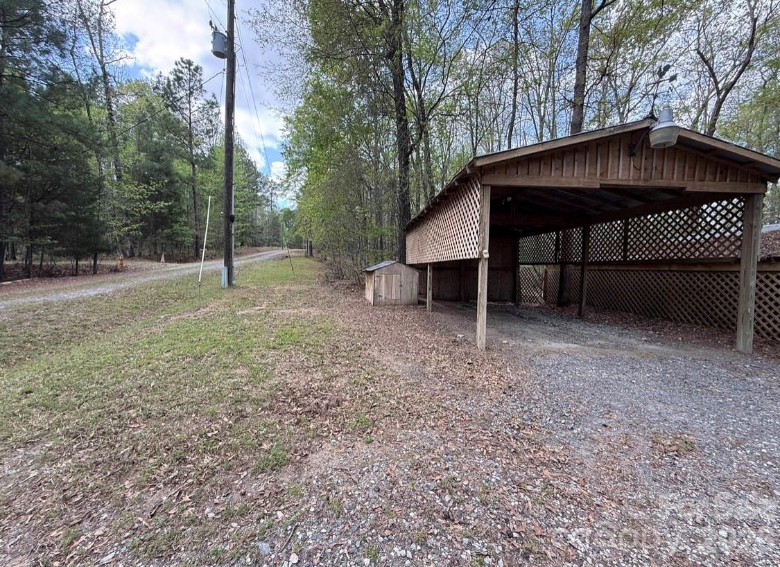 57 Club Lane Winnsboro, SC 29180 - Photo 30 of 48 a view of a house with a yard