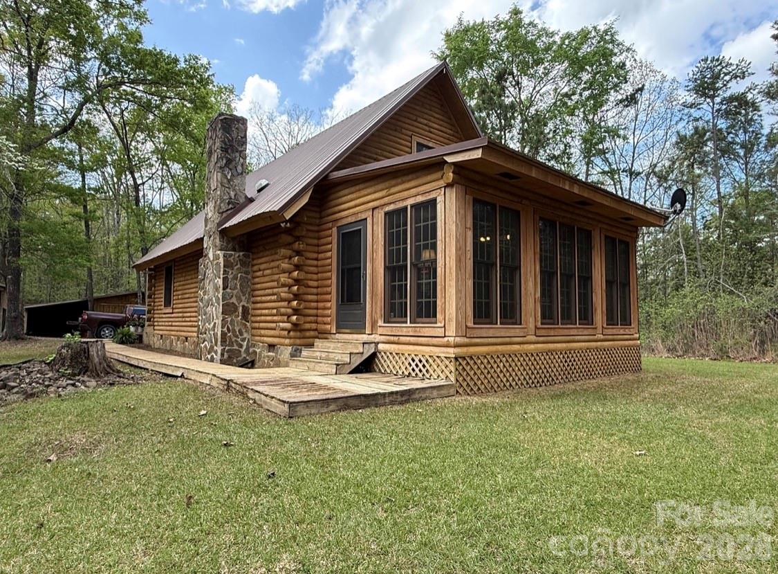 57 Club Lane Winnsboro, SC 29180 - Photo 34 of 48 a front view of a house with garden