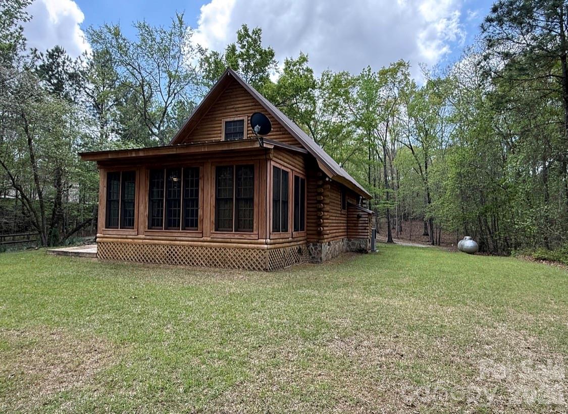 57 Club Lane Winnsboro, SC 29180 - Photo 35 of 48 a view of a house with a yard