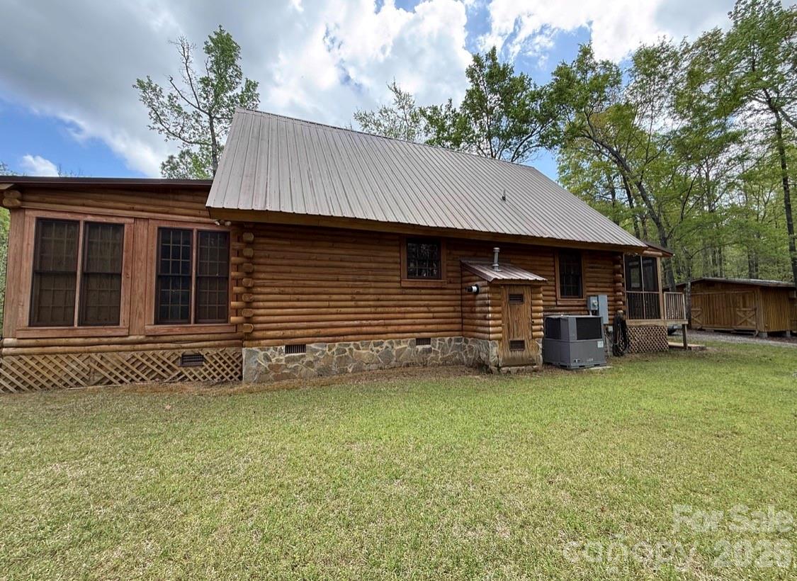 57 Club Lane Winnsboro, SC 29180 - Photo 36 of 48 a front view of a house with a garden