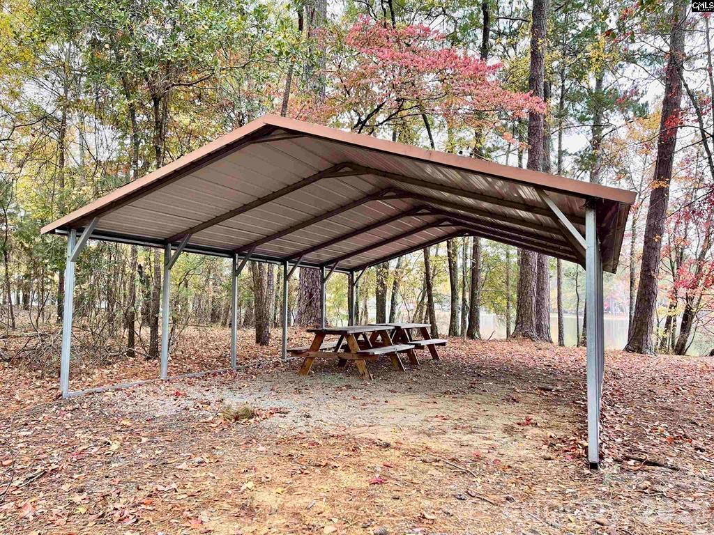 57 Club Lane Winnsboro, SC 29180 - Photo 44 of 48 a backyard of a house with table and chairs