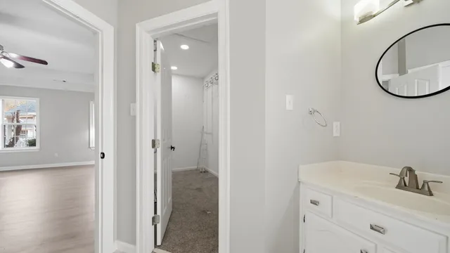 a bathroom with a sink and a mirror