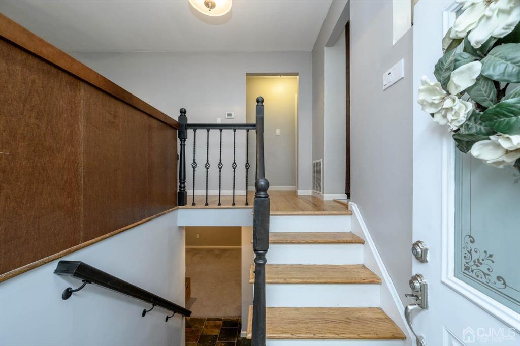 22 Vista Road Hamilton, NJ 08690 - Photo 3 of 38 a view of a staircase with white walls and a window