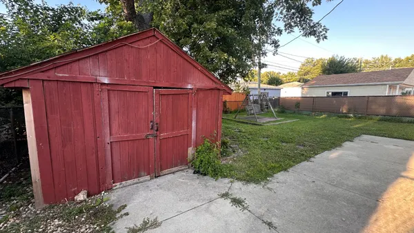 a view of barn with a small yard