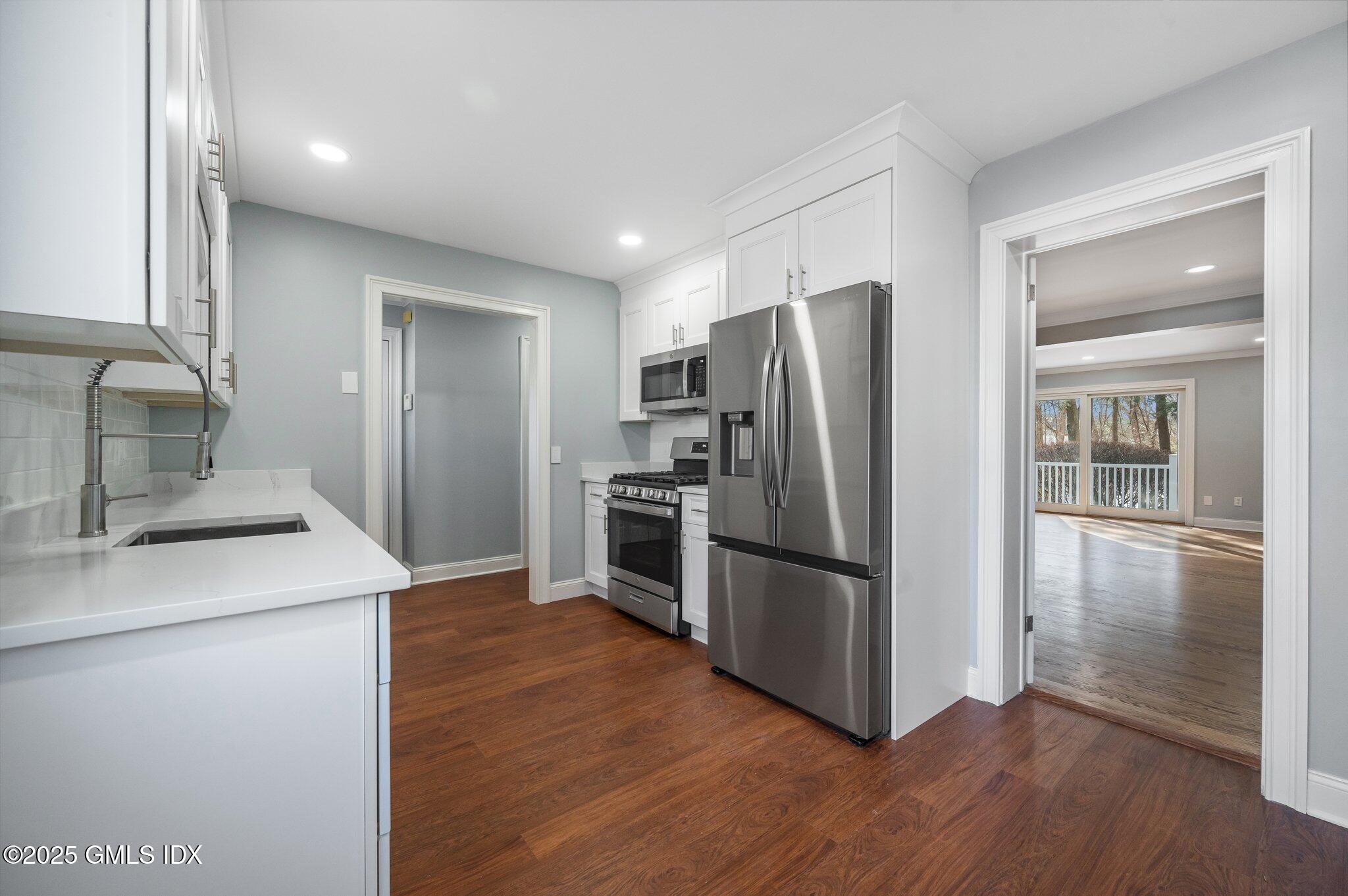 40 Silo Circle Riverside, CT 06878 - Photo 11 of 45 a kitchen with a refrigerator sink and microwave