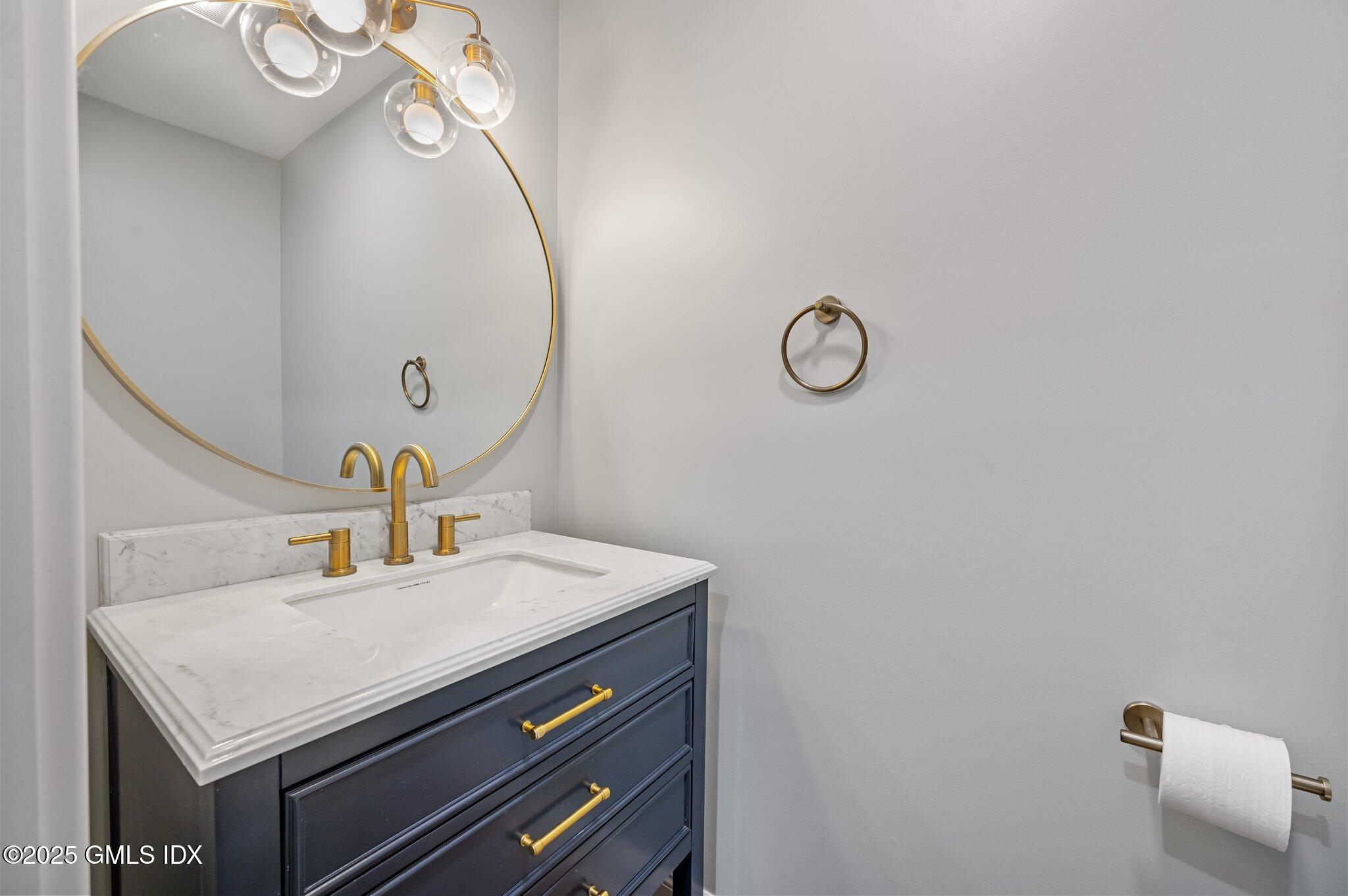 40 Silo Circle Riverside, CT 06878 - Photo 12 of 45 a bathroom with a sink and a mirror