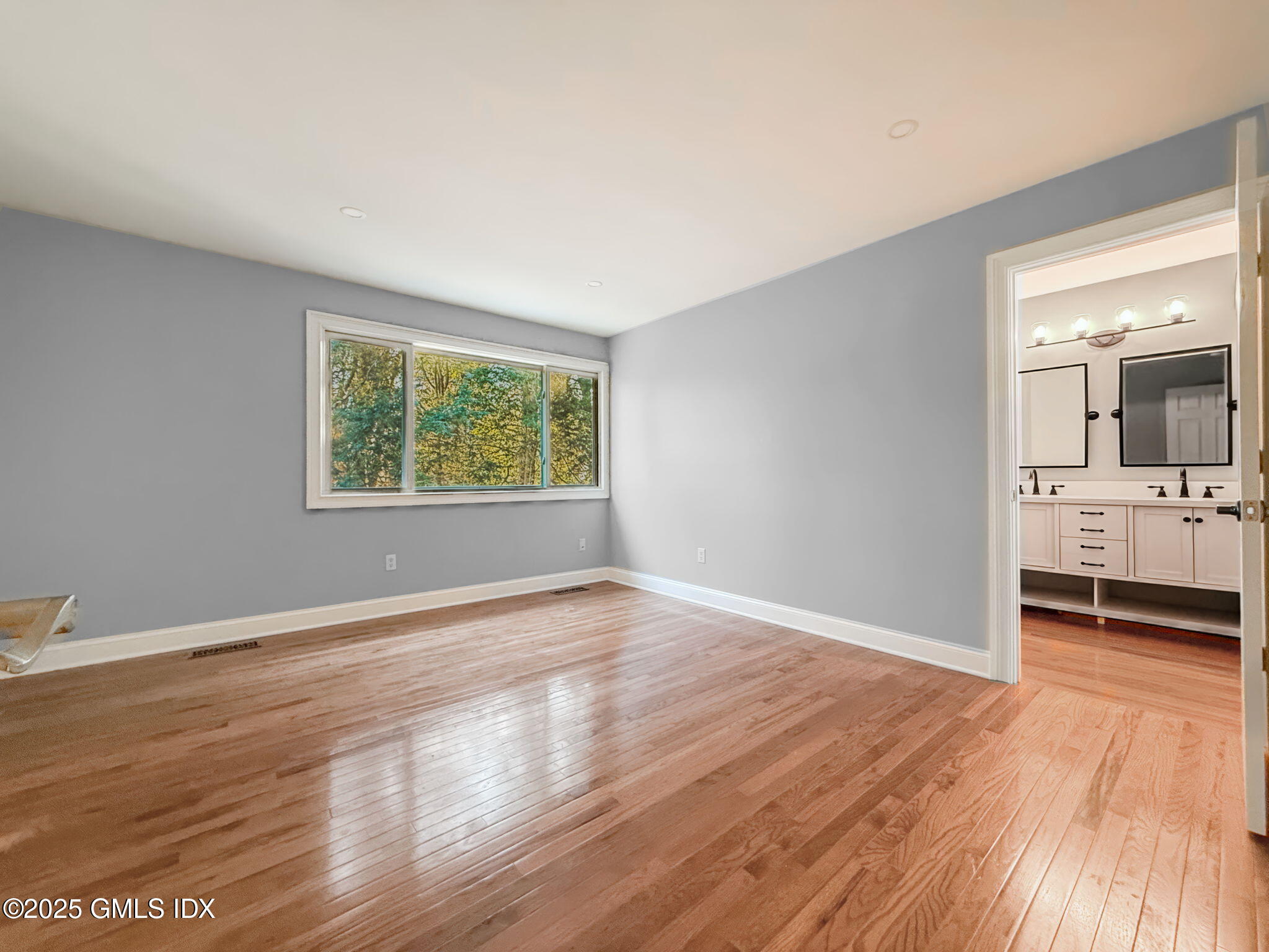 40 Silo Circle Riverside, CT 06878 - Photo 18 of 45 wooden floor in an empty room with a window