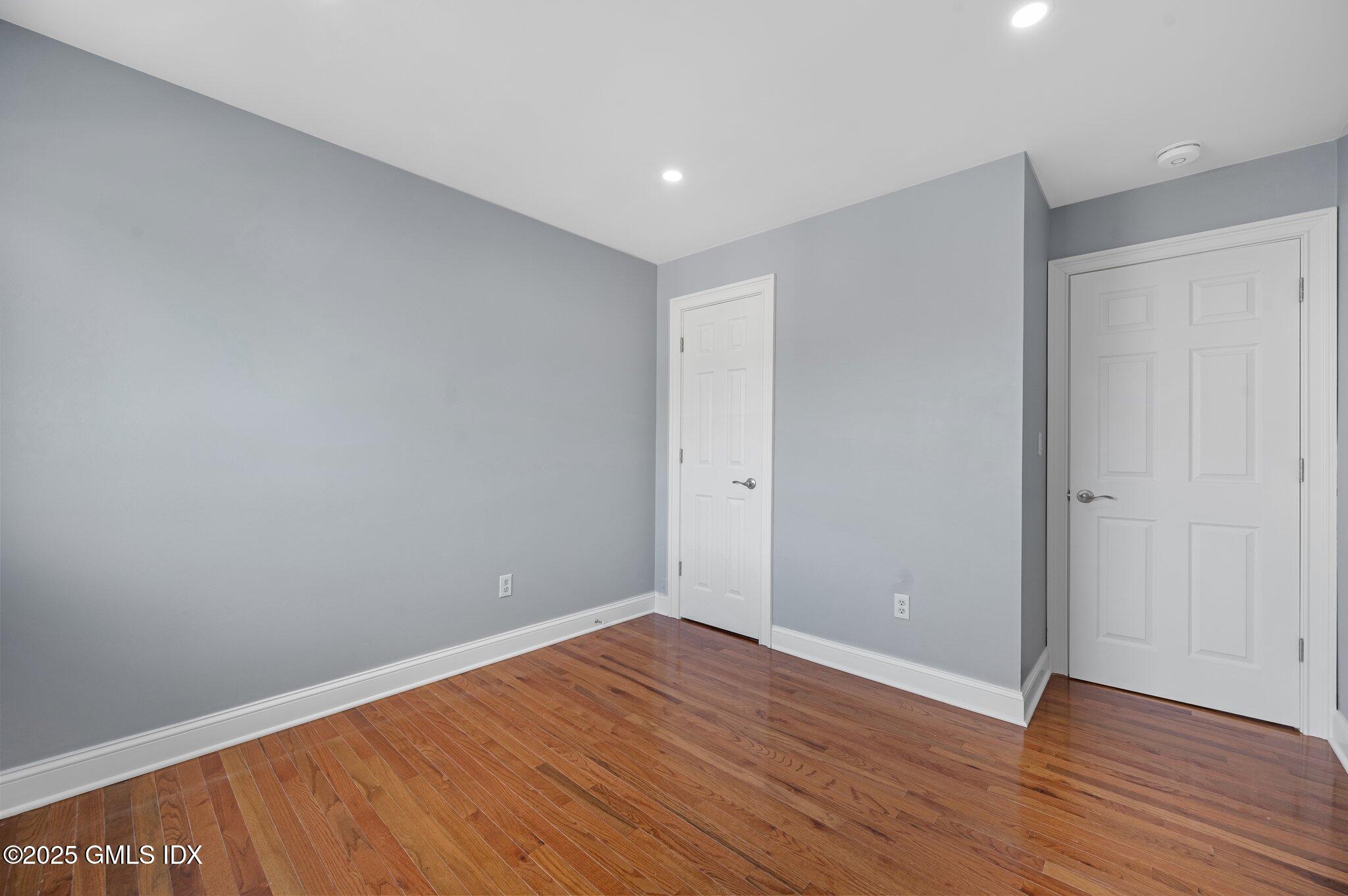 40 Silo Circle Riverside, CT 06878 - Photo 24 of 45 a view of an empty room with wooden floor