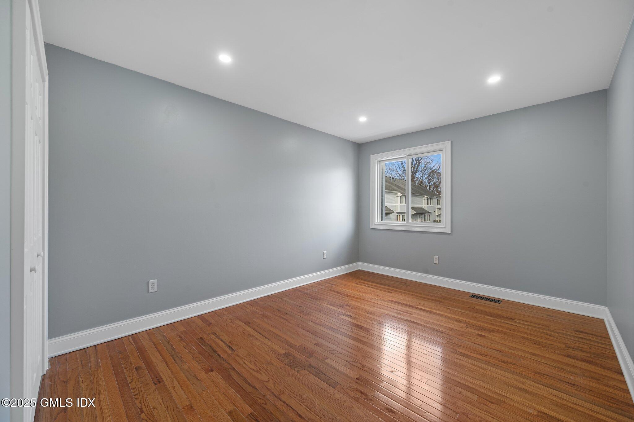 40 Silo Circle Riverside, CT 06878 - Photo 25 of 45 a view of empty room with wooden floor