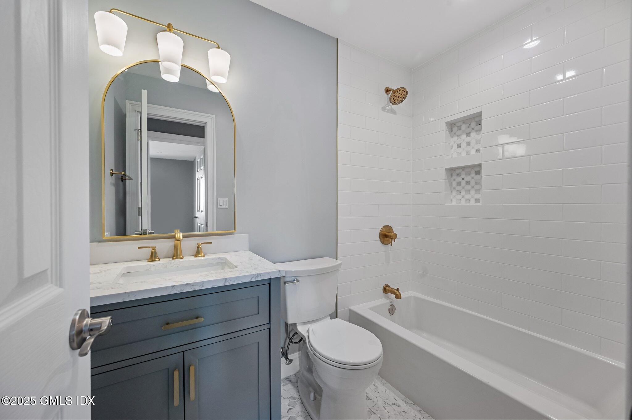 40 Silo Circle Riverside, CT 06878 - Photo 27 of 45 a bathroom with a sink a toilet and shower