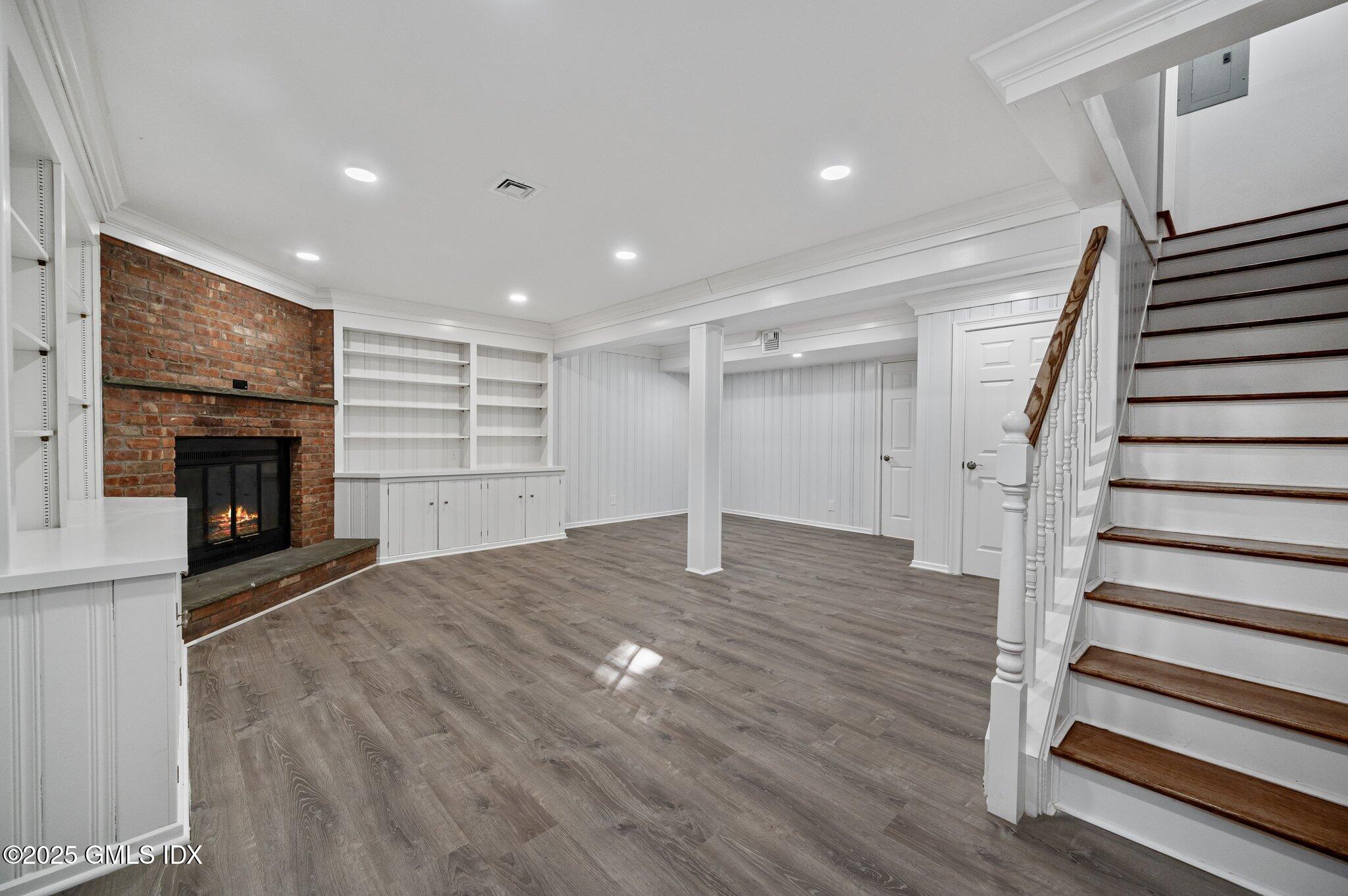 40 Silo Circle Riverside, CT 06878 - Photo 29 of 45 a view of empty room with wooden floor and fireplace