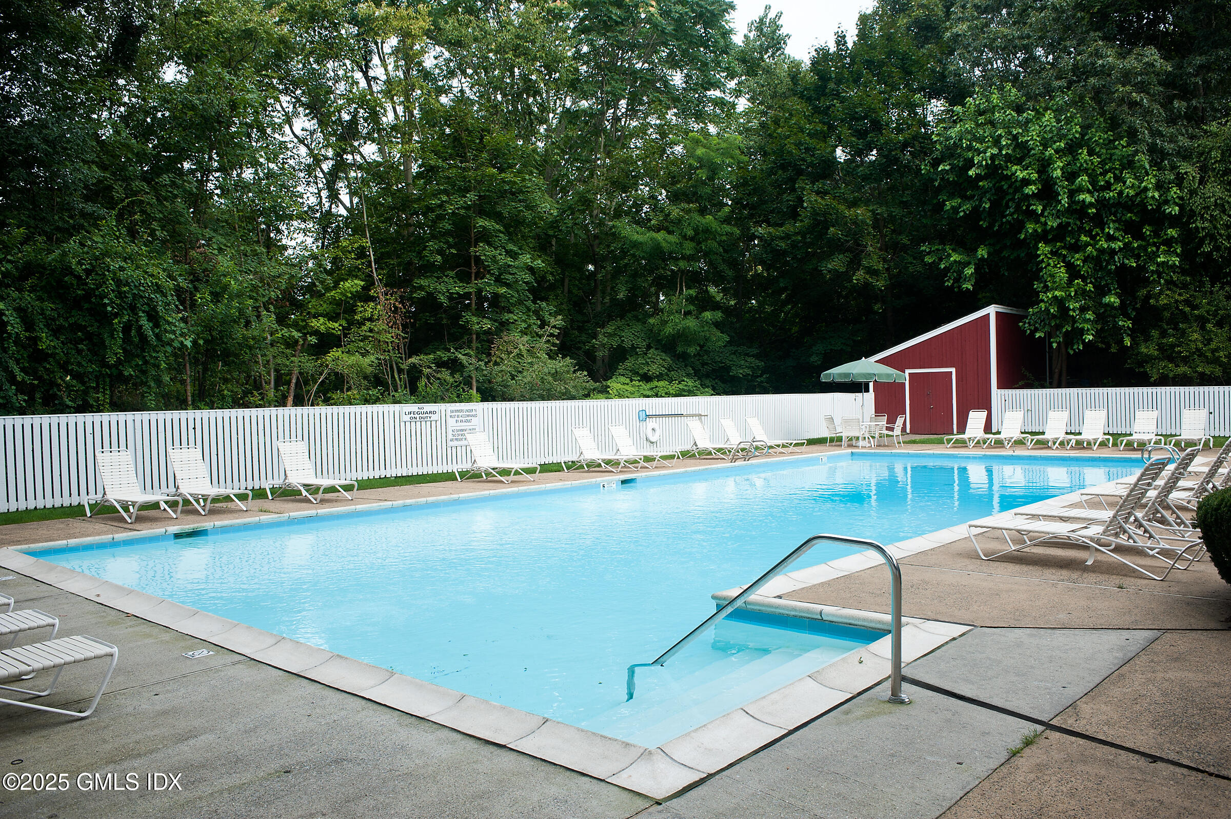 40 Silo Circle Riverside, CT 06878 - Photo 38 of 45 a view of a swimming pool with a lounge chair