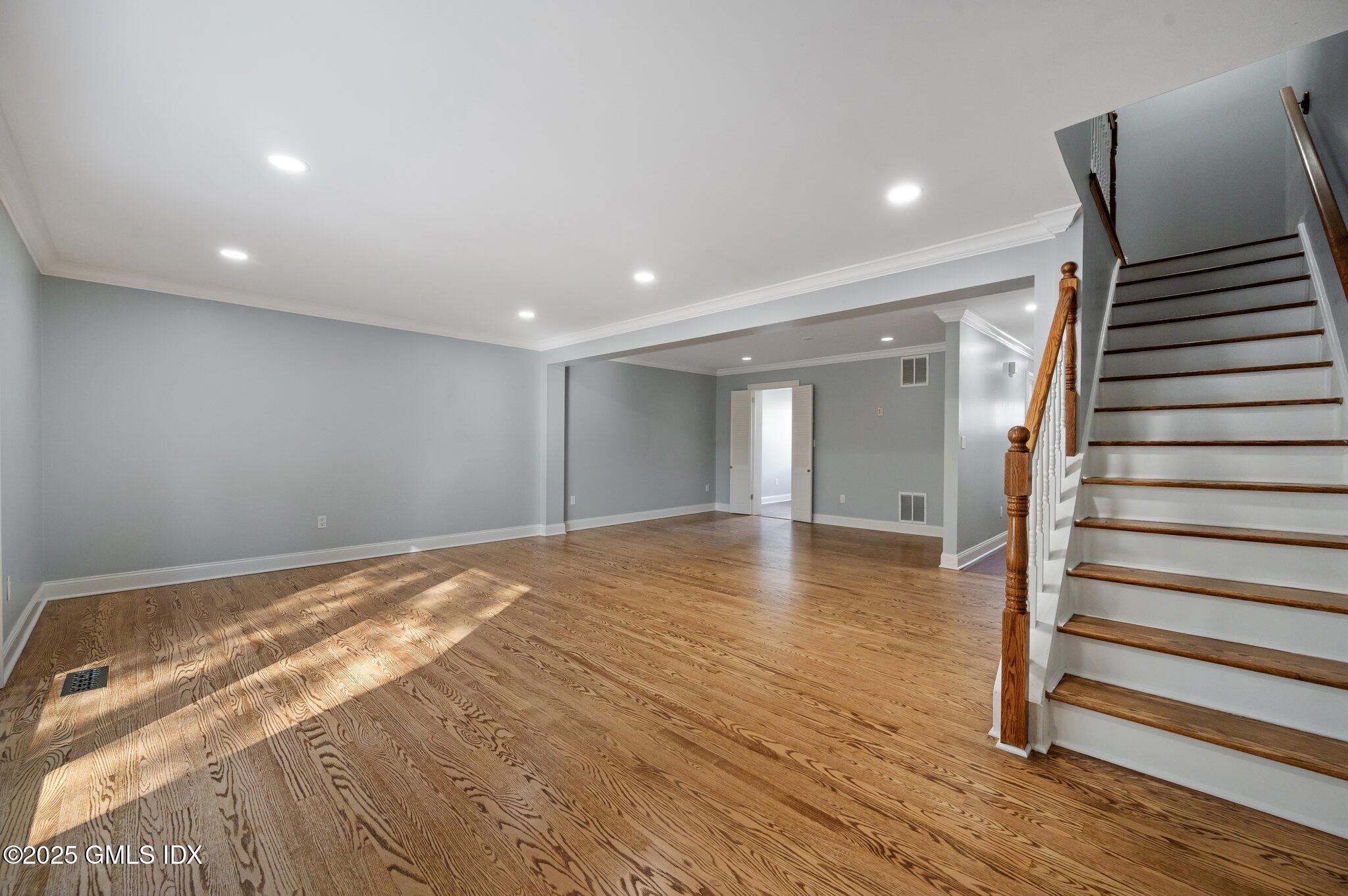 40 Silo Circle Riverside, CT 06878 - Photo 6 of 45 a view of a livingroom with wooden floor and stairs