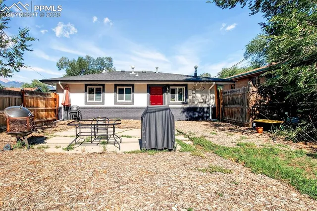 a house view with a backyard space