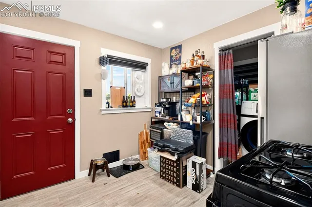a view of a workspace with furniture and closet