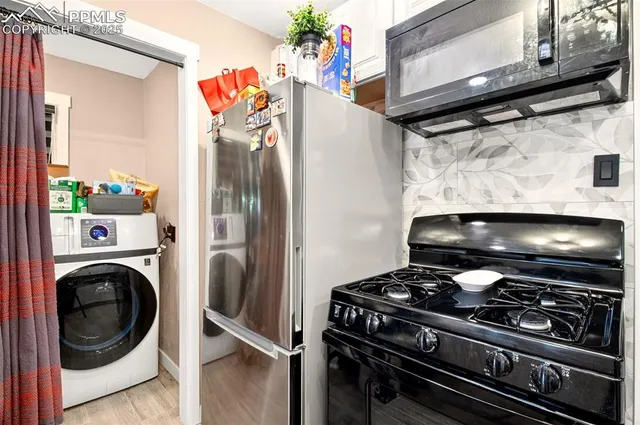 a stove top oven sitting inside of a kitchen