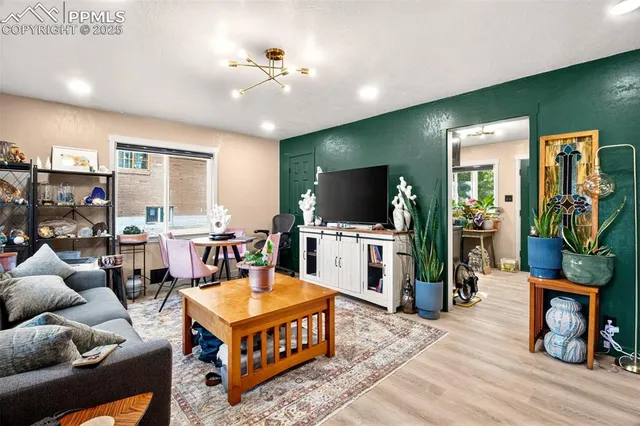 a living room with furniture and a flat screen tv