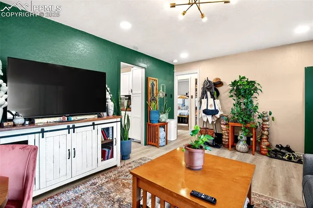 a living room with furniture and a flat screen tv