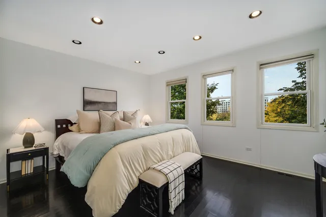 a bedroom with double bed and a window