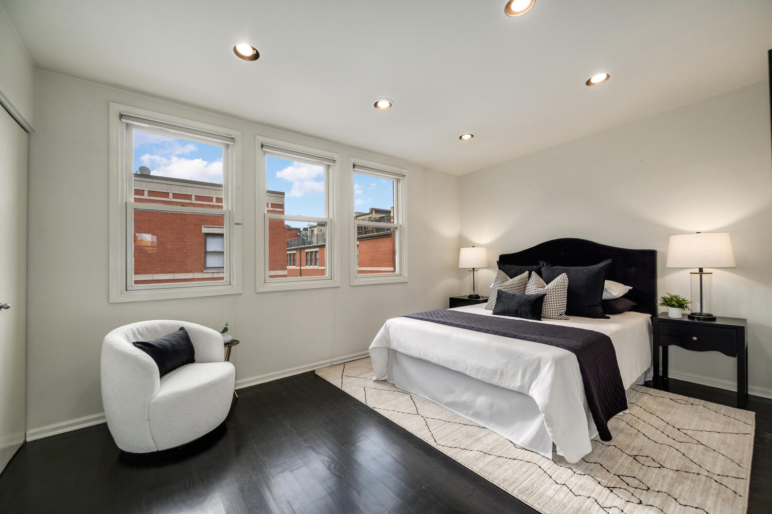 1036 North Crosby Street Chicago, IL 60610 - Photo 15 of 28 a bedroom with a bed and a couch