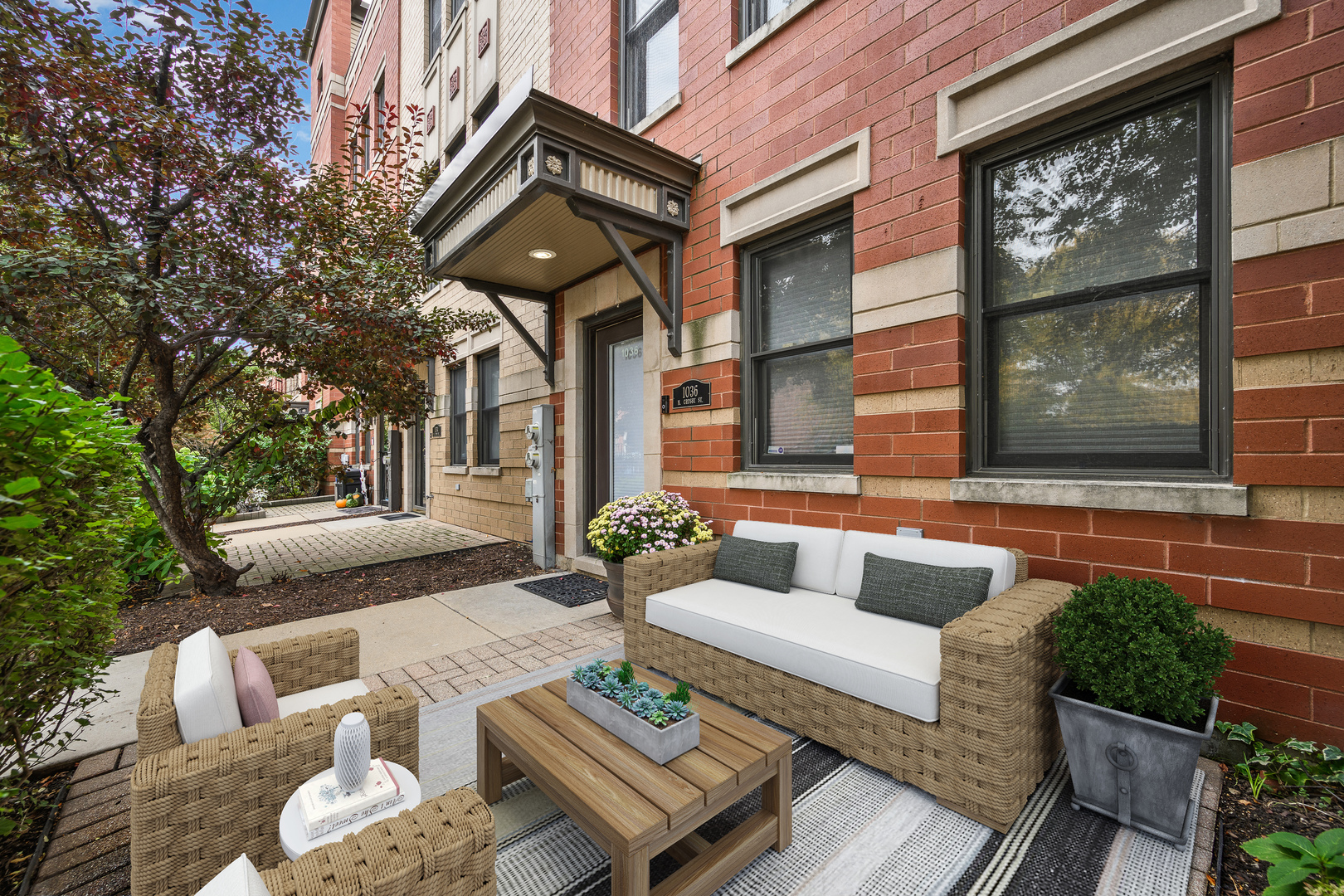 1036 North Crosby Street Chicago, IL 60610 - Photo 2 of 28 a view of a patio with couches and a table and chairs