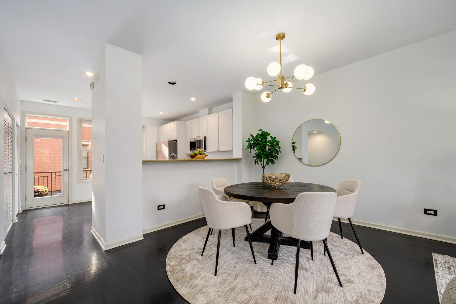 1036 North Crosby Street Chicago, IL 60610 - Photo 7 of 28 a view of a dining room with furniture and wooden floor