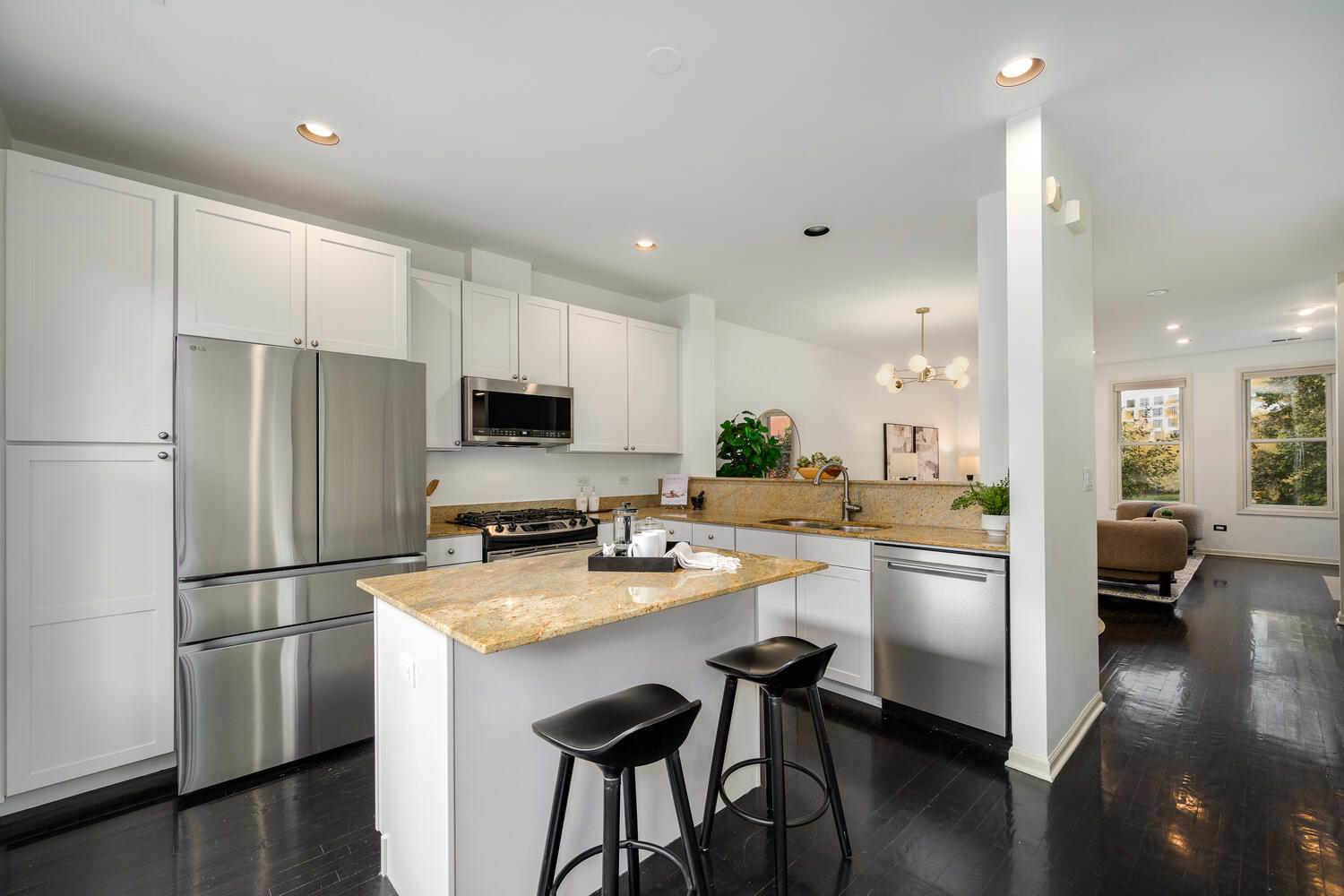 1036 North Crosby Street Chicago, IL 60610 - Photo 10 of 28 a kitchen with stainless steel appliances a refrigerator a stove a sink a dining table and chairs