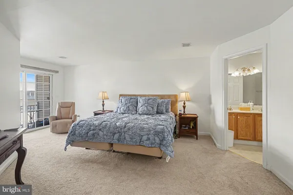 a bedroom with a bed and a table