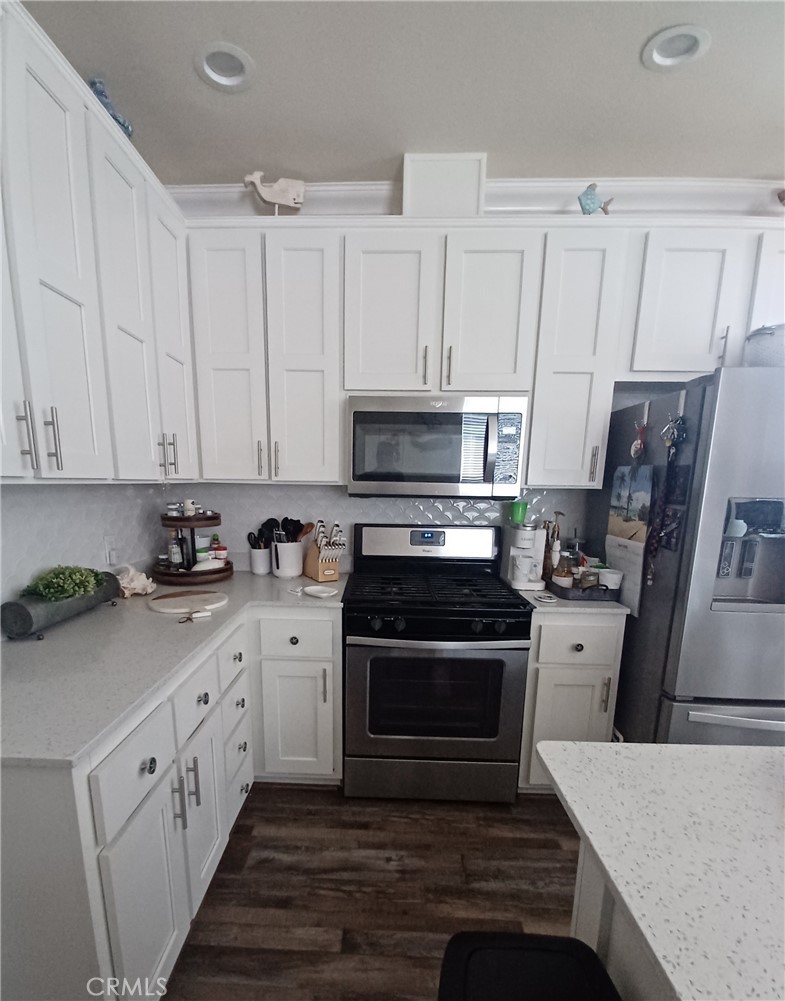 500 Atascadero Road Morro Bay, CA 93442 - Photo 11 of 45 a kitchen with white cabinets sink and stainless steel appliances