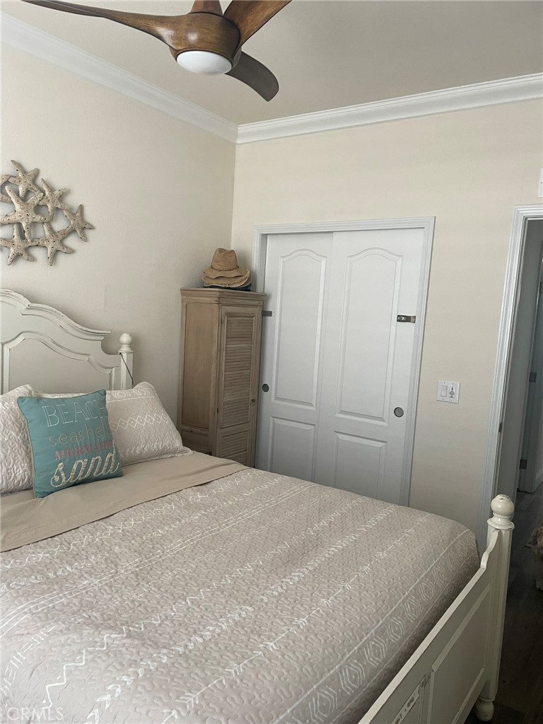 500 Atascadero Road Morro Bay, CA 93442 - Photo 19 of 45 a bedroom with a bed and a ceiling fan