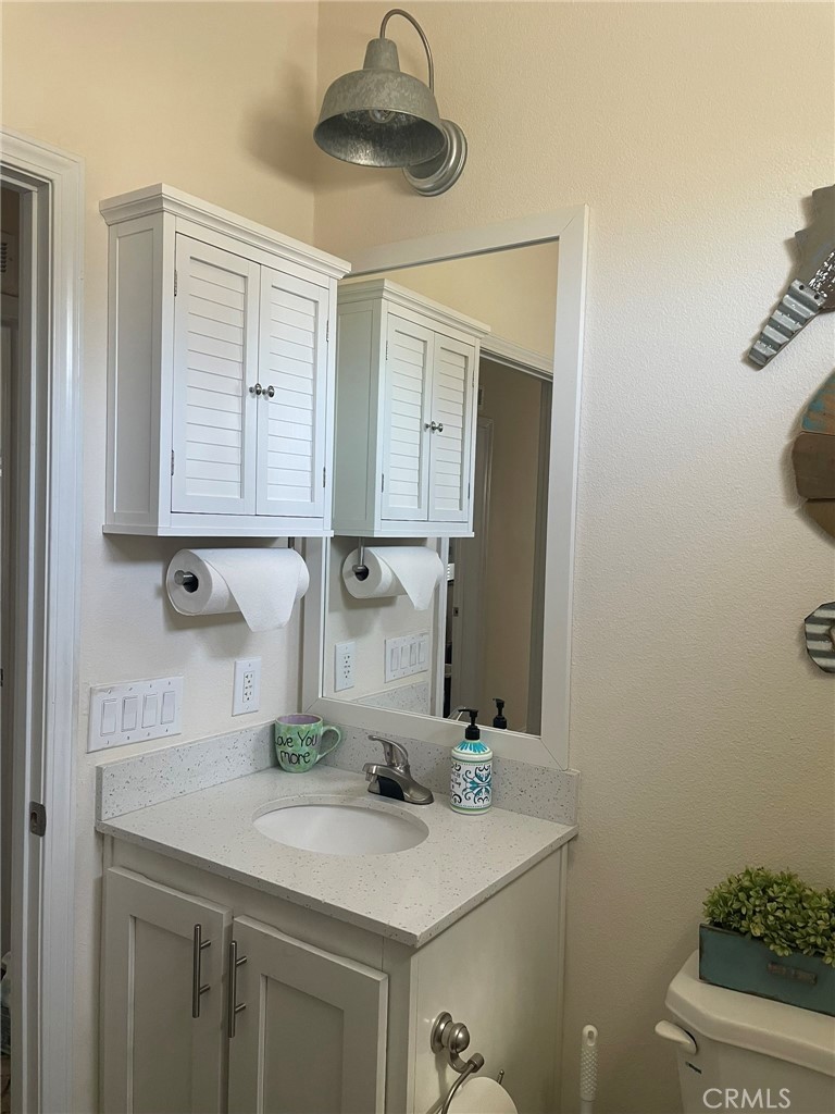 500 Atascadero Road Morro Bay, CA 93442 - Photo 28 of 45 a bathroom with a sink and a mirror