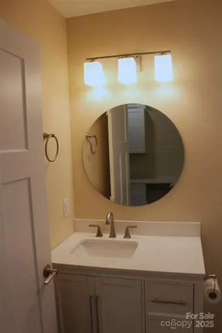a bathroom with a sink and mirror