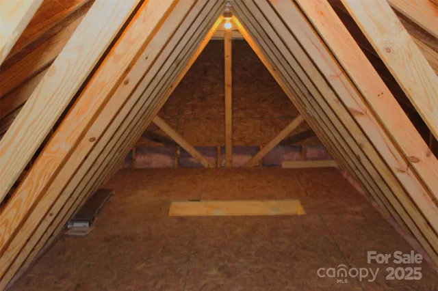 a view of balcony with wooden floor and fence