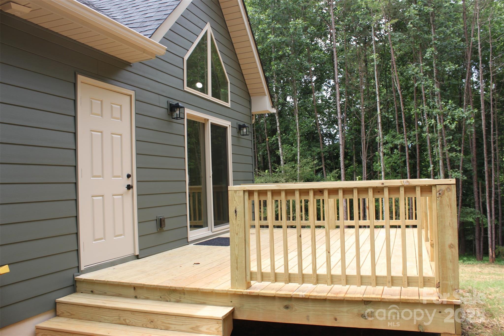 109 Blue Ridge Avenue Extension Elkin, NC 28621 - Photo 19 of 20 a view of balcony with wooden floor and fence